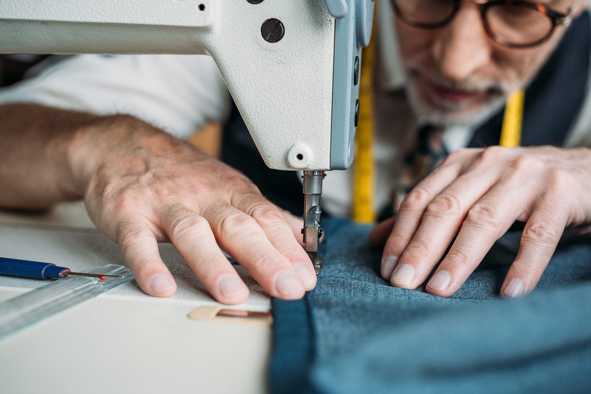 cropped image of dressmaker sewing cloth with sewi WHDDWPP